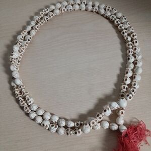 White Beaded Necklace with Red Tassel